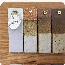 A pale lavender glaze test tile